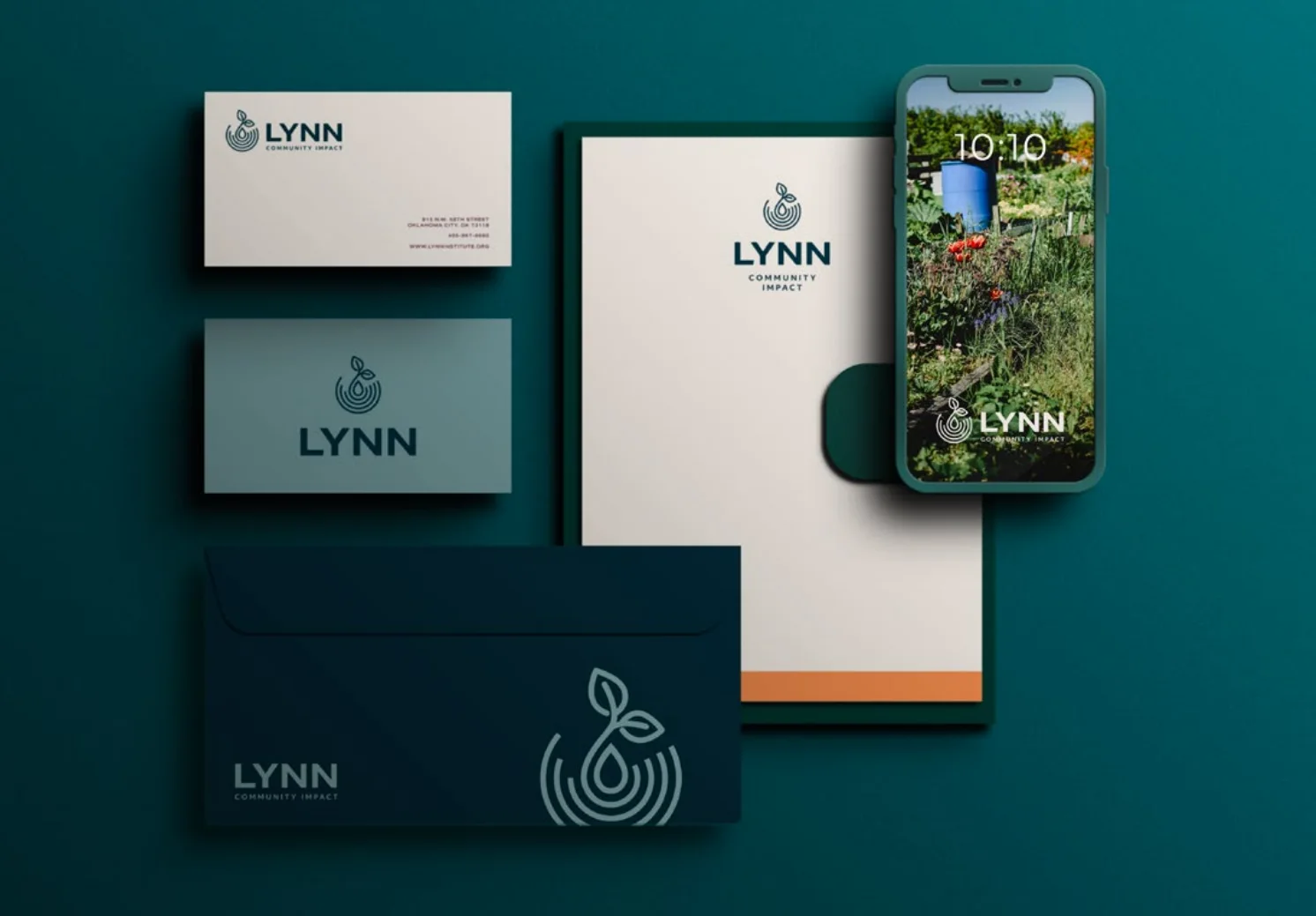 Lynn Community Impact stationery suite with letterhead, envelopes, business cards, and branded phone lock screen