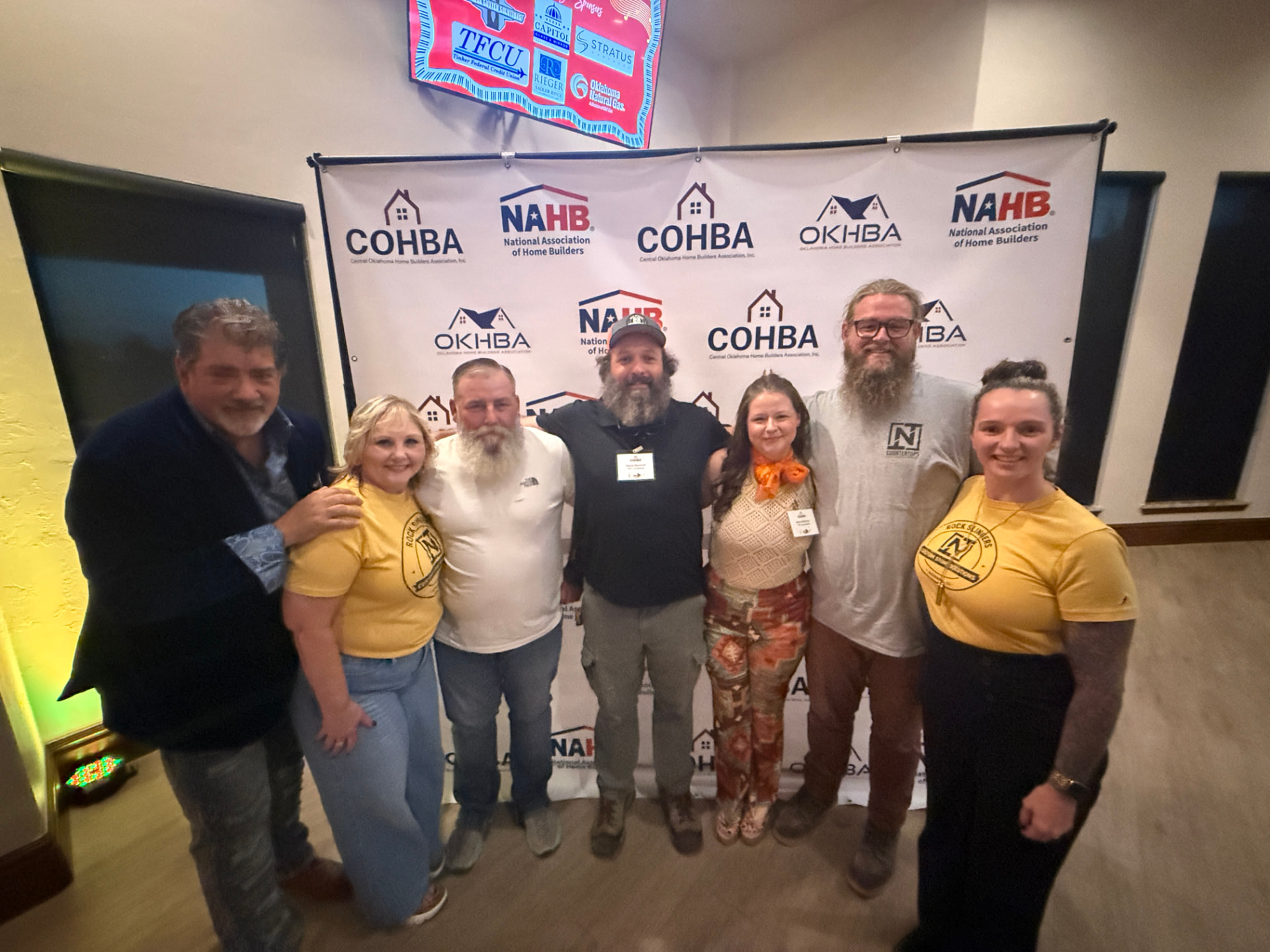 The TNT Countertops team posing together at a COHBA event