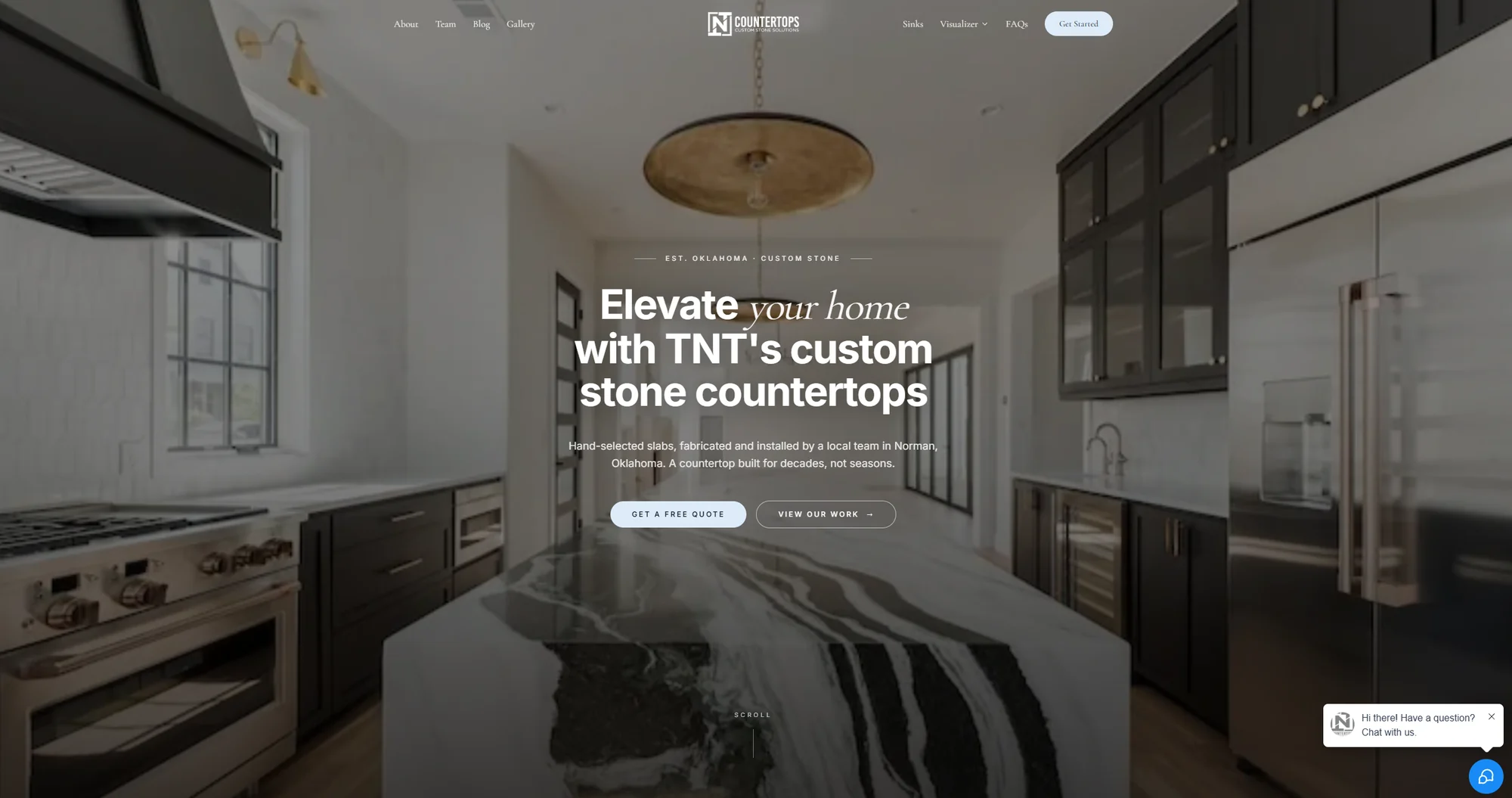 Redesigned TNT Countertops homepage showing a custom stone kitchen island and a clear request-a-quote button
