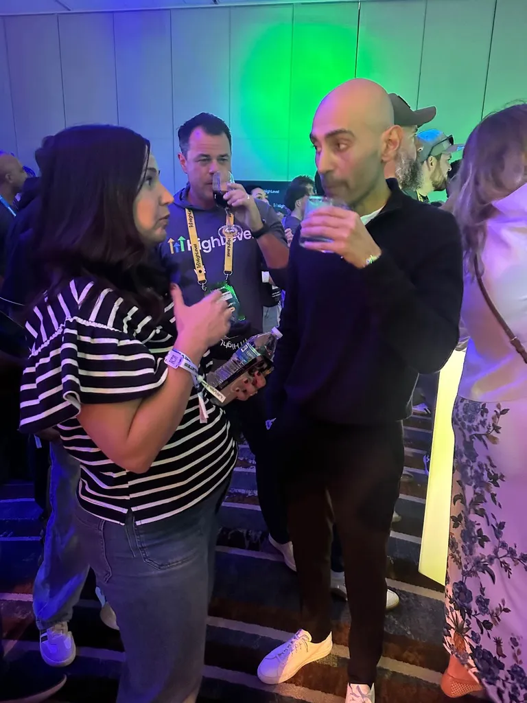Erica Bollinger talking with Neil Patel at a LevelUp 2026 evening event